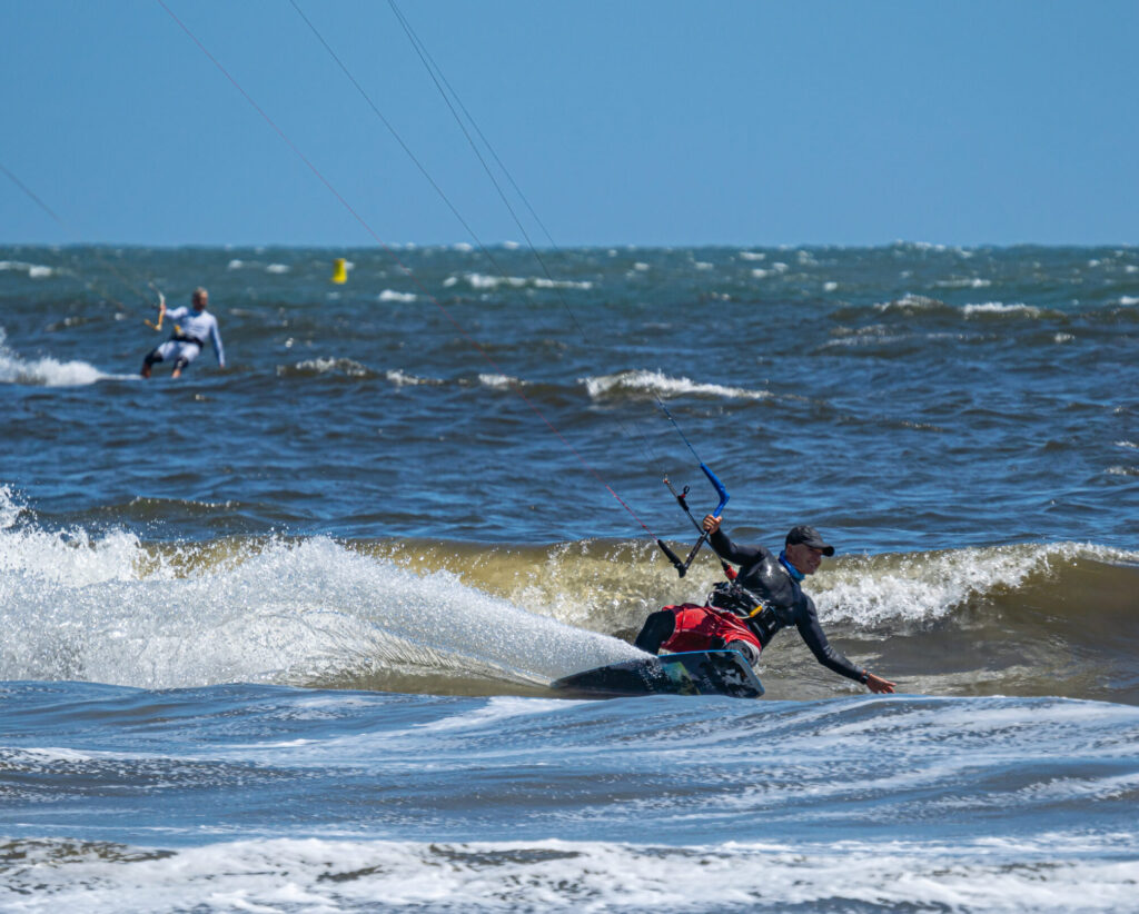 kite surfer in ocean mid-ride