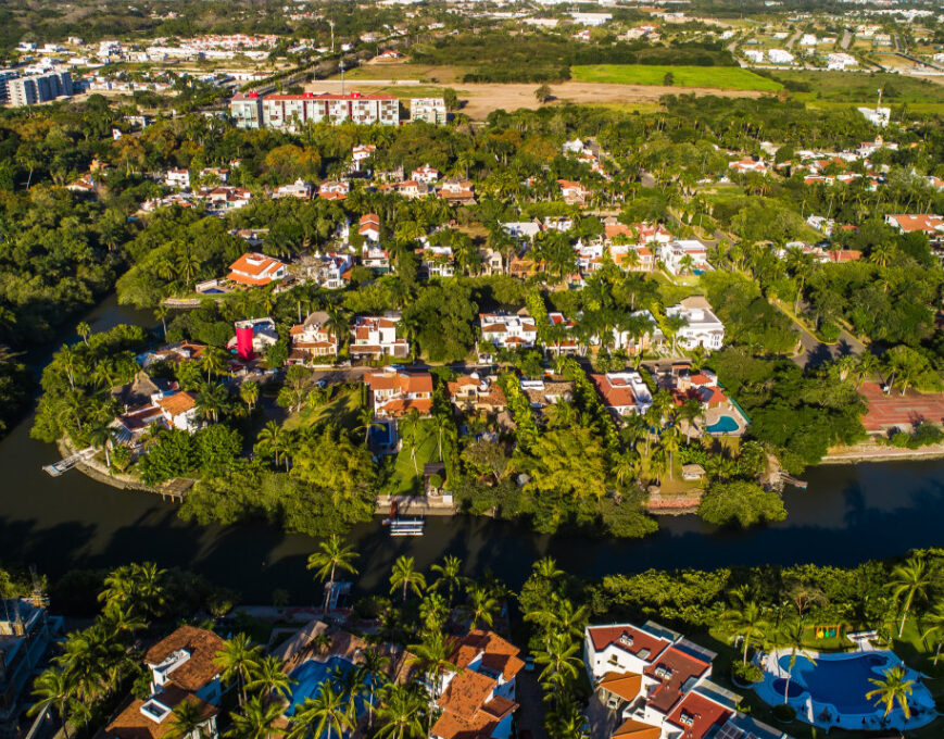 aerial shot of Nuevo Vallarta community with several trees